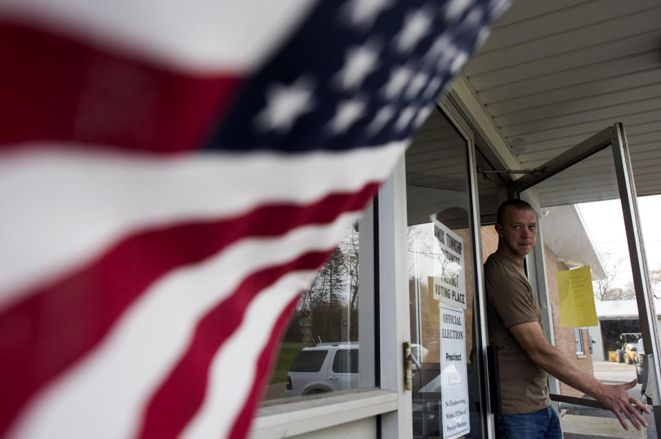 A voter walks out after casting his ballot at the Homeworth Fire Department in Homeworth, Ohio, on Nov. 8.
