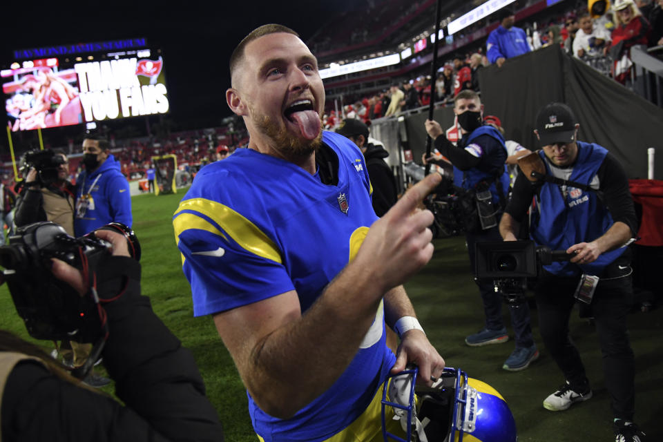 Los Angeles Rams kicker Matt Gay (8) celebrates as he leaves the field after the team defeated the Tampa Bay Buccaneers during an NFL divisional round playoff football game Sunday, Jan. 23, 2022, in Tampa, Fla. (AP Photo/Jason Behnken)