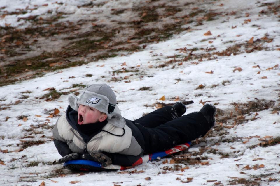 Kids enjoy sleding on Bucks County's first snow day of the season near Mercer Museum in Doylestown on Friday, Jan. 7, 2022.