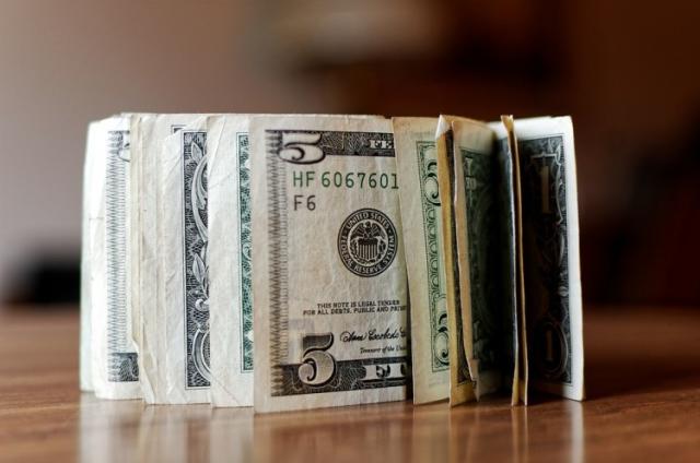 Closeup Of Fifty Dollar Bills On Wooden Table. Fifty Dollar Stock