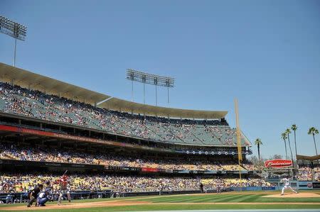 Los Angeles Dodgers starting pitcher Clayton Kershaw (22) pitches against Los Angeles Angels center fielder Mike Trout (27) in the first inning at Dodger Stadium. Mandatory Credit: Gary A. Vasquez-USA TODAY Sports