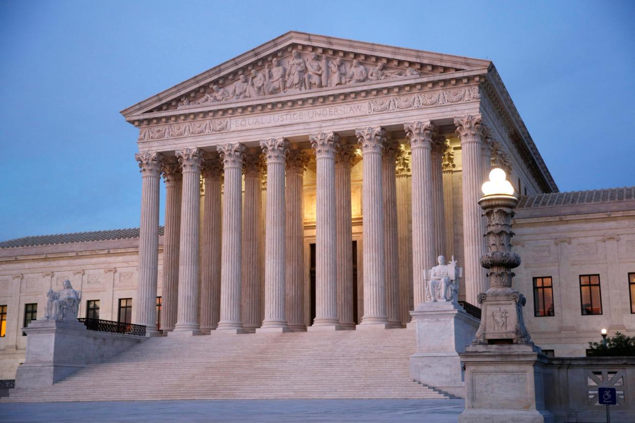 The U.S. Supreme Court building at dusk on Capitol Hill in Washington