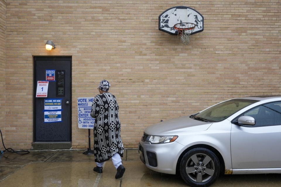 A voter arrives to cast her ballot during the Spring election Tuesday, April 2, 2024, in Milwaukee, Wis. (AP Photo/Morry Gash)