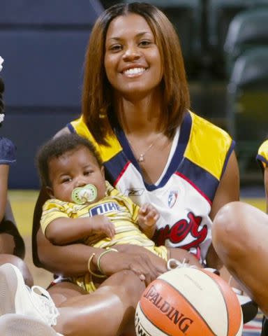 <p>Niele Ivey Instagram</p> Niele Ivey holds Jaden Ivey in this throwback photo.