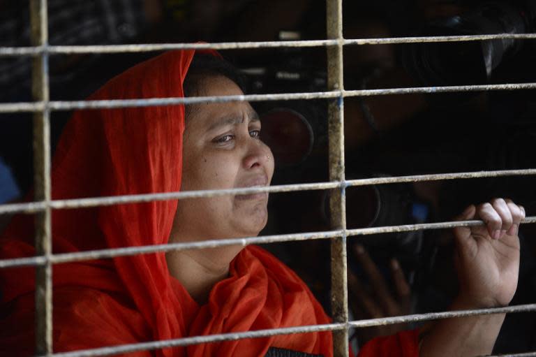 A relative of dead Bangladeshi blogger Washiqur Rahman reacts after seeing his body at Dhaka Medical College in Dhaka on March 30, 2015, after he was killed in an attack in the Bangladeshi capital