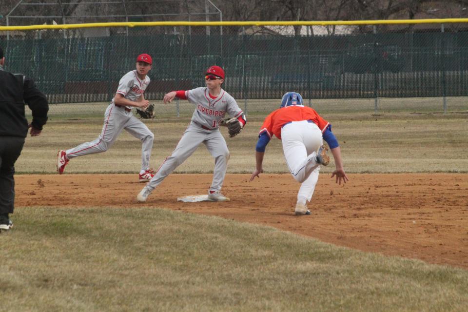 The Devils Lake Firebirds attempt to catch West Fargo Sheyenne in a steal attempt.