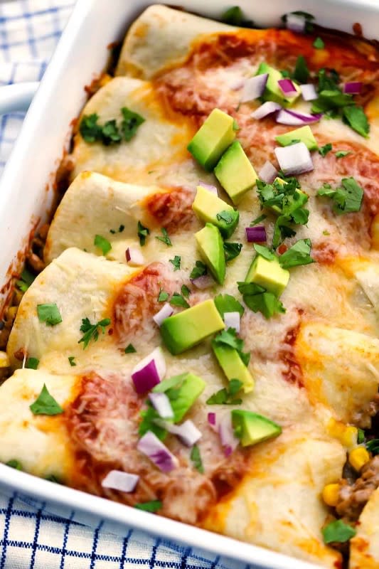 <p>Bowl of Delicious</p><p>This recipe for healthy turkey enchiladas is packed with good-for-you ingredients like lean ground turkey, fiber-rich black beans and sweet corn!</p><p><strong>Get the recipe: <a href="https://www.bowlofdelicious.com/turkey-enchiladas/" rel="nofollow noopener" target="_blank" data-ylk="slk:Turkey Enchiladas with Black Beans and Corn;elm:context_link;itc:0;sec:content-canvas" class="link ">Turkey Enchiladas with Black Beans and Corn</a></strong></p>