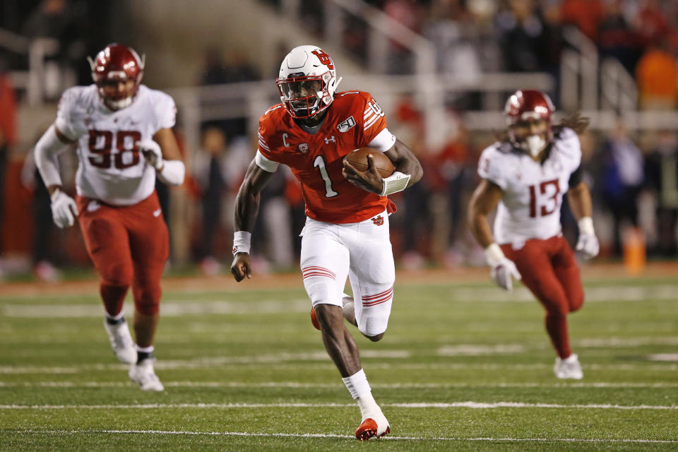 Utah quarterback Tyler Huntley (1) carries the ball against Washington State in the first half of an NCAA college football game Saturday, Sept. 28, 2019, in Salt Lake City. (AP Photo/Rick Bowmer)