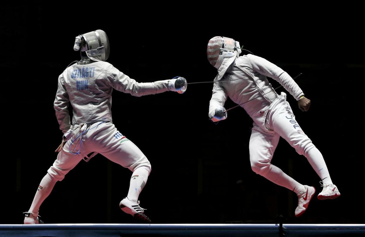 2016 Rio Olympics - Fencing - Final - Men's Sabre Individual Gold Medal Bout - Carioca Arena 3 - Rio de Janeiro, Brazil - 10/08/2016. Daryl Homer (USA) of USA competes with Aron Szilagyi (HUN) of Hungary. REUTERS/Issei Kato FOR EDITORIAL USE ONLY. NOT FOR SALE FOR MARKETING OR ADVERTISING CAMPAIGNS.