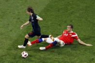 <p>Luka Modric leaps over Russia’s Artyom Dzyuba in Sochi </p>