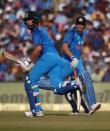 Cricket - India v England - Second One Day International - Barabati Stadium, Cuttack, India - 19/01/17. India's Mahendra Singh Dhoni and Yuvraj Singh run between the wickets. REUTERS/Adnan Abidi