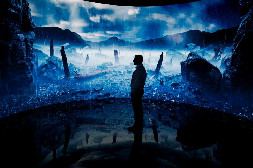 December 1, 2023: A man looks at a digital display at an exhibition by the Andrey Melnichenko Foundation during the COP28 United Nations climate summit in Dubai on December 1, 2023. World leaders take centre stage at UN climate talks in Dubai on December 1, under pressure to step up efforts to limit global warming as the Israel-Hamas conflict casts a shadow over the summit.