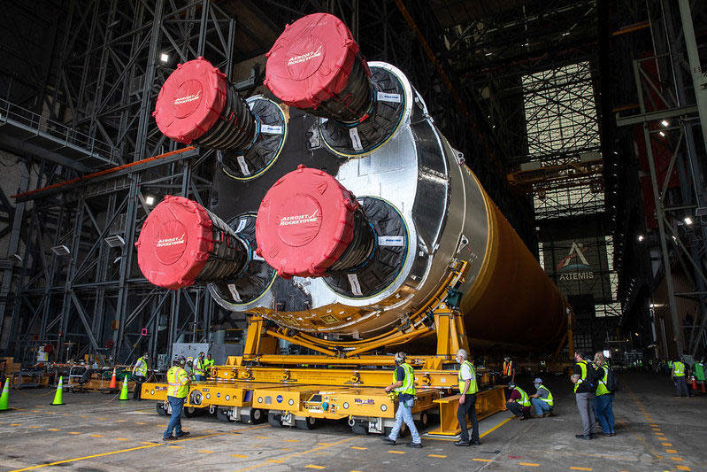 The business end of the first Space Launch System core stage being moved inside the Vehicle Assembly Building at the Kennedy Space Center. NASA plans to launch the huge new rocket on an unpiloted maiden flight around the moon late this year. / Credit: NASA