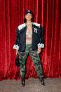 <p>Attending the Gucci, Wooster St, New York store opening. Wearing a Yankees cap and embroidered jacket, with camo pants, lace heels, and a sheer top.</p>