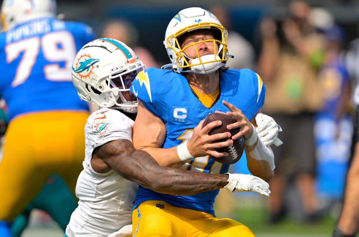 Los Angeles Chargers quarterback Justin Herbert is sacked at the 1-yard line by Miami Dolphins cornerback Kader Kohou.