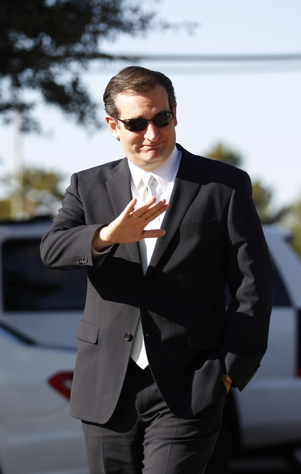 Sen. Ted Cruz (R-Texas) waves as he arrives at a polling station to speak to media and voters in Dallas, Thursday, Nov. 1, 2012. Cruz faces Democratic candidate Paul Sadler for the U.S. Senate seat vacated by fellow Republican Kay Bailey Hutchison. (AP Photo/LM Otero)