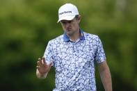 Justin Rose, of England, waves after his putt on the 17th hole during the second round of the PGA Championship golf tournament at Oak Hill Country Club on Friday, May 19, 2023, in Pittsford, N.Y. (AP Photo/Seth Wenig)
