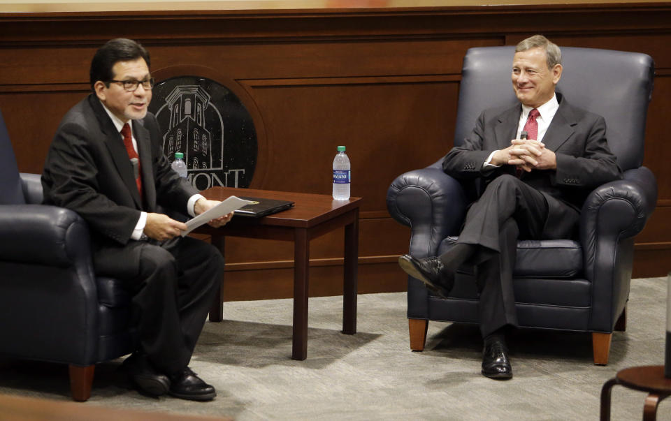 Supreme Court Chief Justice John Roberts, right, takes part in a forum with Belmont University Law Dean Alberto Gonzales, left, at Belmont University Wednesday, Feb. 6, 2019, in Nashville, Tenn. (AP Photo/Mark Humphrey)