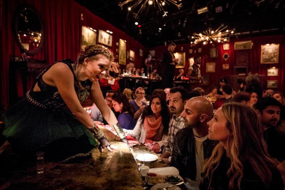 This undated theater image released by The Hartman Group shows Catherine Brookman in "Natasha, Pierre and the Great Comet of 1812," a dinner theater performance that opened Thursday, May 15, 2013 in the meatpacking district of New York. (AP Photo/The Hartman Group, Chad Batka)