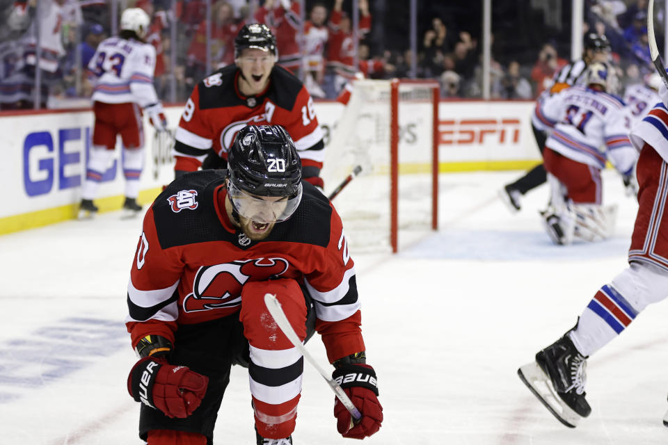 New Jersey Devils center Michael McLeod (20) reacts after scoring a goal past New York Rangers goaltender Igor Shesterkin during the second period of Game 7 of an NHL hockey Stanley Cup first-round playoff series Monday, May 1, 2023, in Newark, N.J. (AP Photo/Adam Hunger)