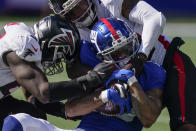 New York Giants wide receiver Kenny Golladay (19) is tackled by Atlanta Falcons defensive back T.J. Green, right, during the second half of an NFL football game, Sunday, Sept. 26, 2021, in East Rutherford, N.J. (AP Photo/Seth Wenig)