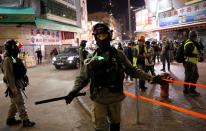 A police officer guards the area after an anti-government protest at Yoho Mall in Yuen Long