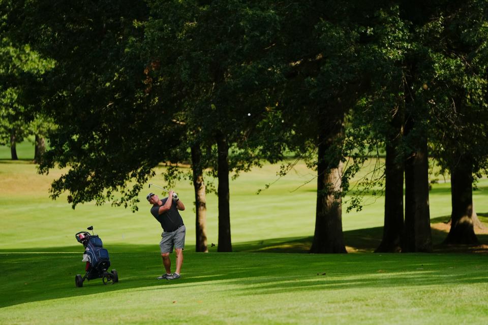 Sep 8, 2023; Carroll, OH, USA; Kevin Colburn of Lancaster hits an approach shot onto the ninth green at Pine Hill Golf Course.