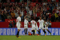 Soccer Football - Champions League Playoffs - Sevilla v Istanbul Basakshehir - Seville, Spain - August 22, 2017 Sevilla’s Sergio Escudero celebrates scoring their first goal with Joaquin Correa, Steven N'Zonzi and team mates REUTERS/Jon Nazca