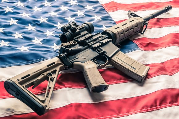 Modern sporting rifle lying on American flag