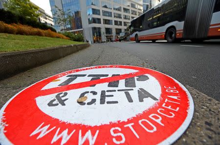 A placard reading " STOP TTIP CETA" is seen outside the EU Council headquarters ahead of a European Union leaders summit in Brussels, Belgium October 20, 2016. REUTERS/Yves Herman