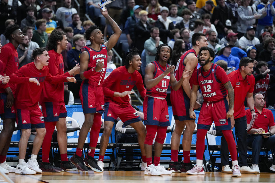 The Florida Atlantic celebrates in the second half of a first-round college basketball game in the men's NCAA Tournament in Columbus, Ohio, Friday, March 17, 2023. Florida Atlantic defeated Memphis 66-65. (AP Photo/Michael Conroy)