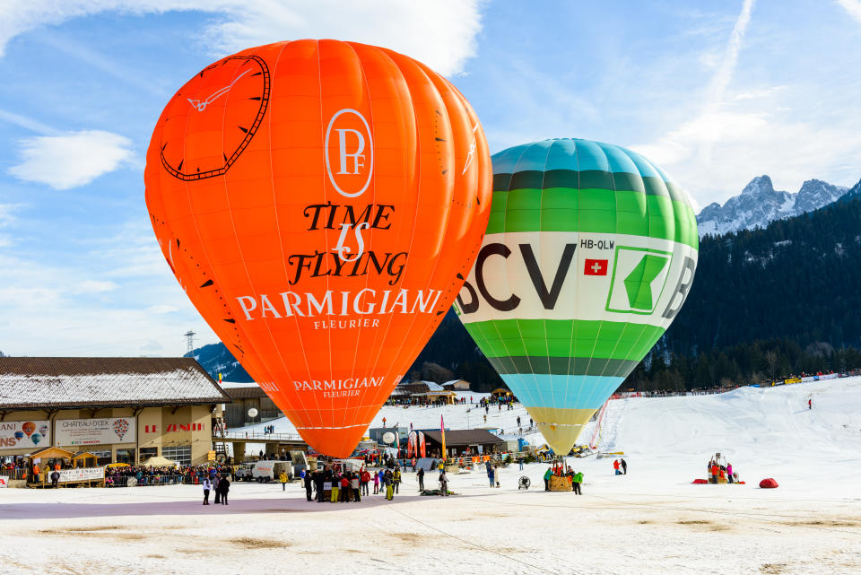 Preparation of the hot air balloons for a flight demonstration during the yearly International Hot Air Balloon Festival of Chateau d'Oex, Switzerland.