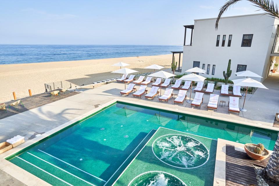 Outdoor pool and beach at Hotel San Cristobal in Todos Santos