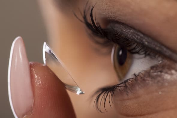 close-up view of the adjustment of contact lenses