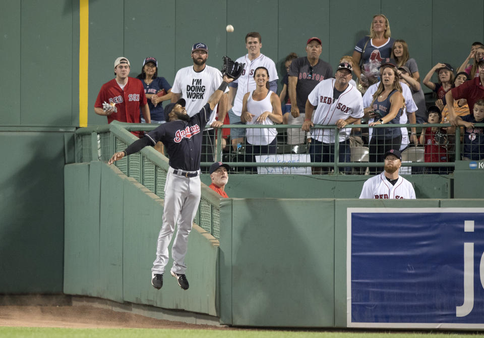 Indians outfielder Austin Jackson went over the wall to make this excellent catch. (Getty Images)