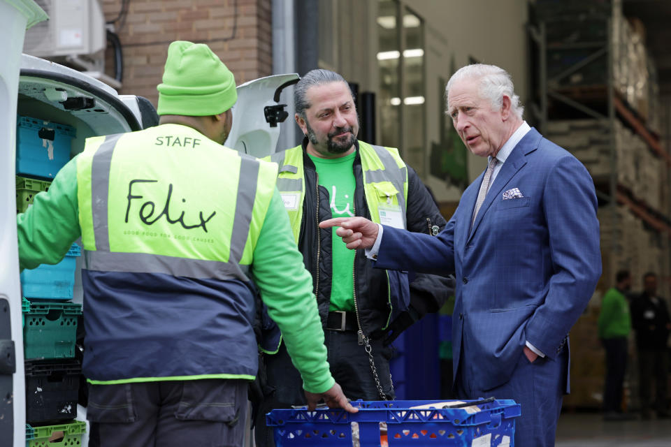 King Charles talked to staff at the Felix Project as they loaded meals into their electric vehicle. (Getty Images)