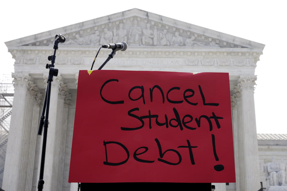 A sign reading "cancel student debt" is seen outside the Supreme Court, Friday, June 30, 2023, in Washington. A sharply divided Supreme Court has ruled that the Biden administration overstepped its authority in trying to cancel or reduce student loans for millions of Americans. Conservative justices were in the majority in Friday’s 6-3 decision that effectively killed the $400 billion plan that President Joe Biden announced last year. (AP Photo/Mariam Zuhaib)