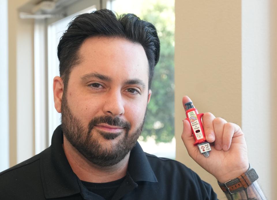 Blaise Finnegan, an admissions coordinator with Rise Recovery program at Family Hospital Systems and recovering drug addict, said a naloxone shot saved his life from a fentanyl overdose after two nasal sprays of Narcan failed to revive him.