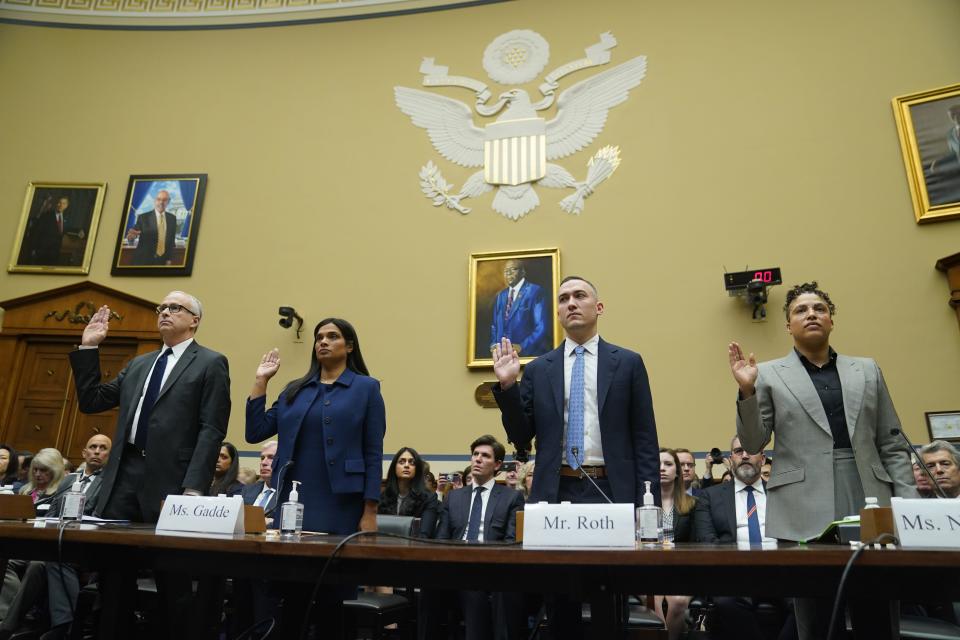 From left, James Baker, Former Deputy General Counsel at Twitter, Vijaya Gadde, Former Chief Legal Officer at Twitter, Yoel Roth Former Global Head of Trust & Safety Twitter, and Anika Collier Navaroli, a former Twitter employee, are sworn in during the House Committee on Oversight and Accountability hearing on "Protecting Speech from Government Interference and Social Media Bias, Part 1: Twitter's Role in Suppressing the Biden Laptop Story," on Feb. 8, 2023, in Washington.