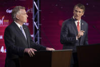 Virginia Democratic gubernatorial candidate and former Gov. Terry McAuliffe, left, and Republican challenger, Glenn Youngkin, participate in a debate at Northern Virginia Community College, in Alexandria, Va., Tuesday, Sept. 28, 2021. (AP Photo/Cliff Owen)