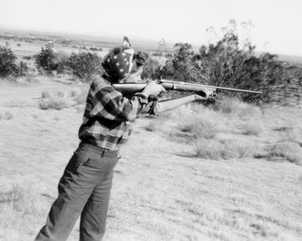 Marilyn firing a long gun
