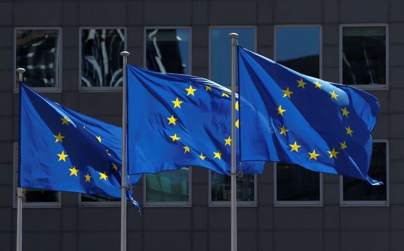 FILE PHOTO: European Union flags flutter outside the European Commission headquarters in Brussels