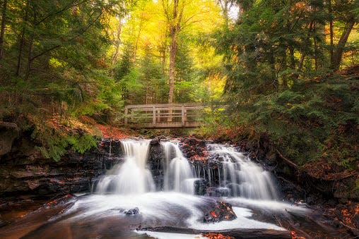 Autumn colors over Upper Chapel Falls. Pictured Rocks is a national park along the Lake Superior shore near Munising in Michigan's Upper Peninsula.