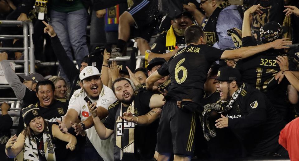 Danilo Silva celebrates with supporters after equalizing for LAFC, but the expansion club lost its playoff match to Real Salt Lake after fans delayed the match. (LAFC)