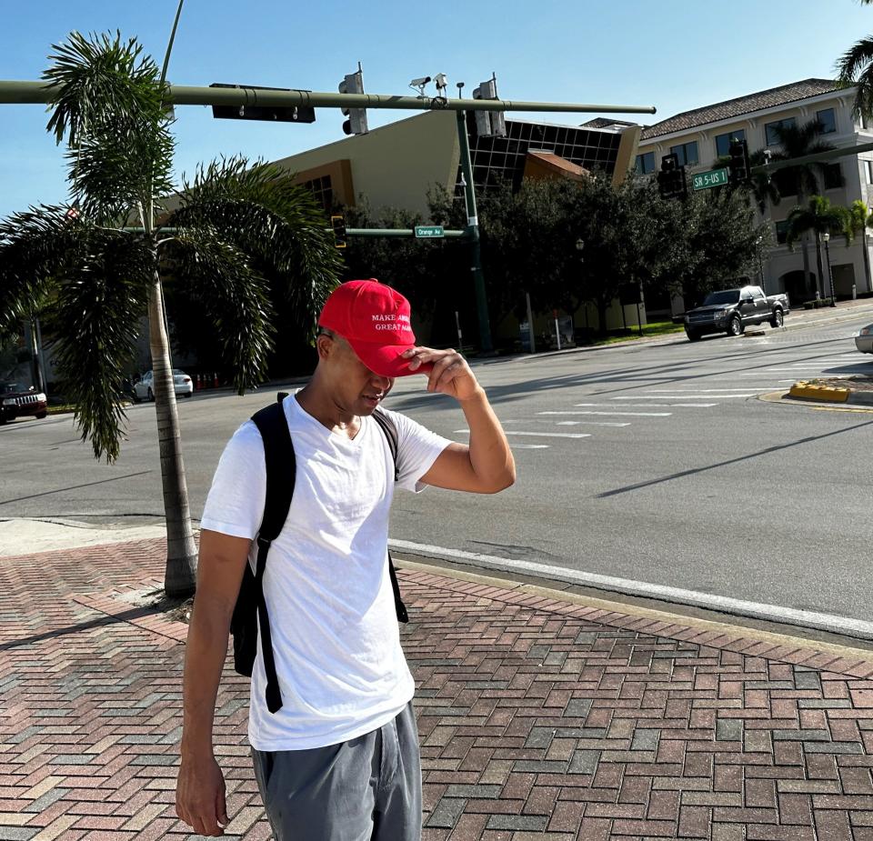 Rafael Gomez Osorio, of Miami, traveled to Fort Pierce to show his support for former president Donald Trump, wearing his MAGA cap outside the Alto Lee Adams, Sr. U.S. Courthouse.