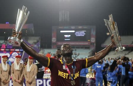 Cricket - England v West Indies - World Twenty20 cricket tournament final - Kolkata, India - 03/04/2016. West Indies captain Darren Sammy holds trophies after winning the final. REUTERS/Rupak De Chowdhuri