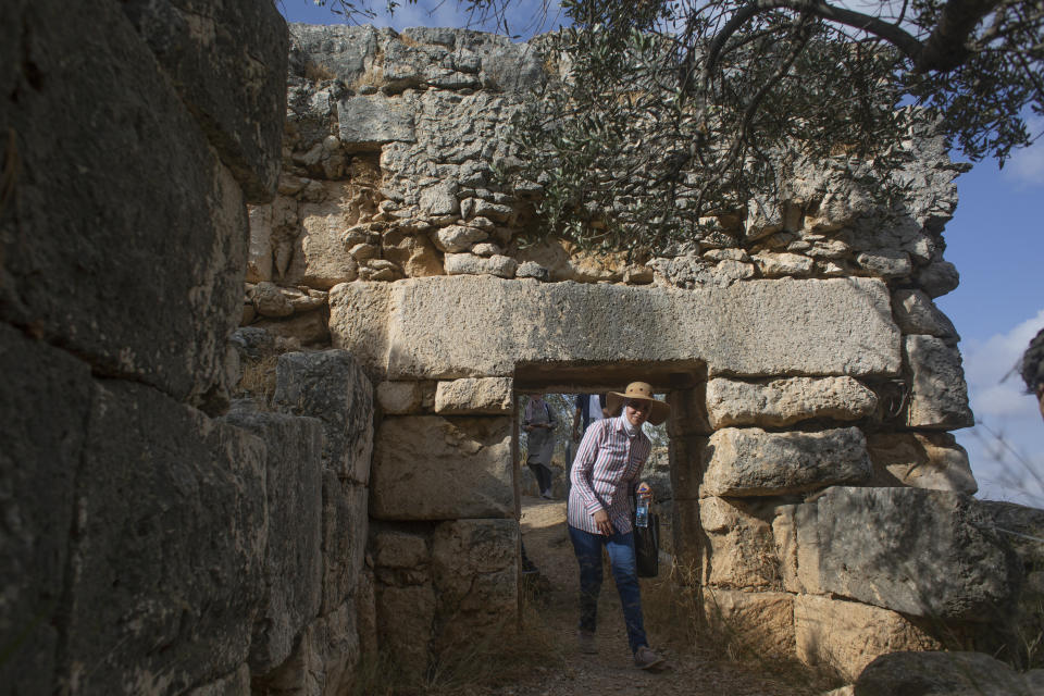 Hikers explore Deir Qalaa, "Monastery of the Castle," the remains of a Byzantine monastery near the Jewish settlement of Peduel and the Palestinian village of Deir Balout, west of the West Bank city of Salfit, Friday, June. 11, 2021. A growing number of Palestinians are taking up hiking, which offers a way to explore the countryside and historical landmarks in the Israeli-occupied West Bank. (AP Photo/Nasser Nasser)