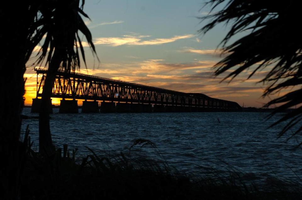 The old bridge at sunset is framed by thatch pines at Bahia State Park.