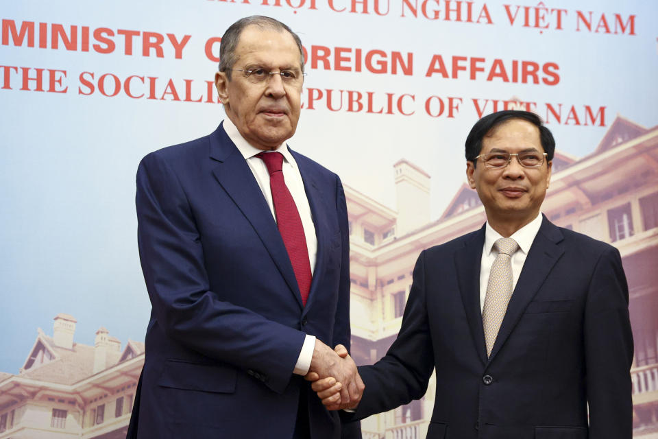 In this photo released by Russian Foreign Ministry Press Service, Russian Foreign Minister Sergey Lavrov, left, and Vietnamese Foreign Minister Bui Thanh Son shake hands during their meeting in Hanoi, Vietnam on Wednesday, July 6, 2022. Lavrov is on a trip to Asia to seek support amid his country's diplomatic isolation by the West and punishing sanctions leveled over its invasion of Ukraine. (Russian Foreign Ministry Press Service via AP)