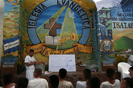 Former members of the Barrio 18 gang participate in a religious service of the Torre Fuerte (Strong Tower) church inside the San Francisco Gotera prison, in San Francisco Gotera, El Salvador, March 9, 2018. REUTERS/Jose Cabezas